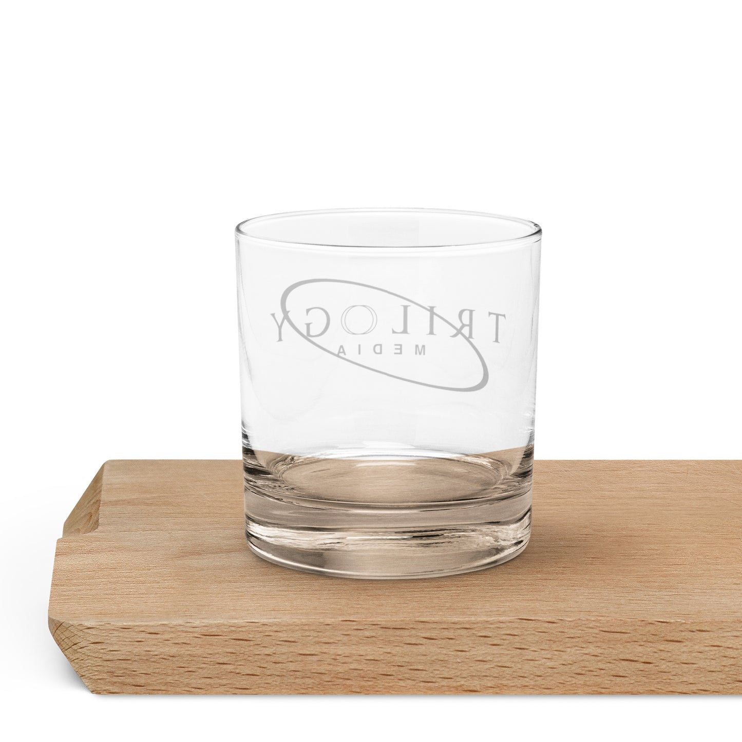 Trilogy Media Logo | Rocks glass