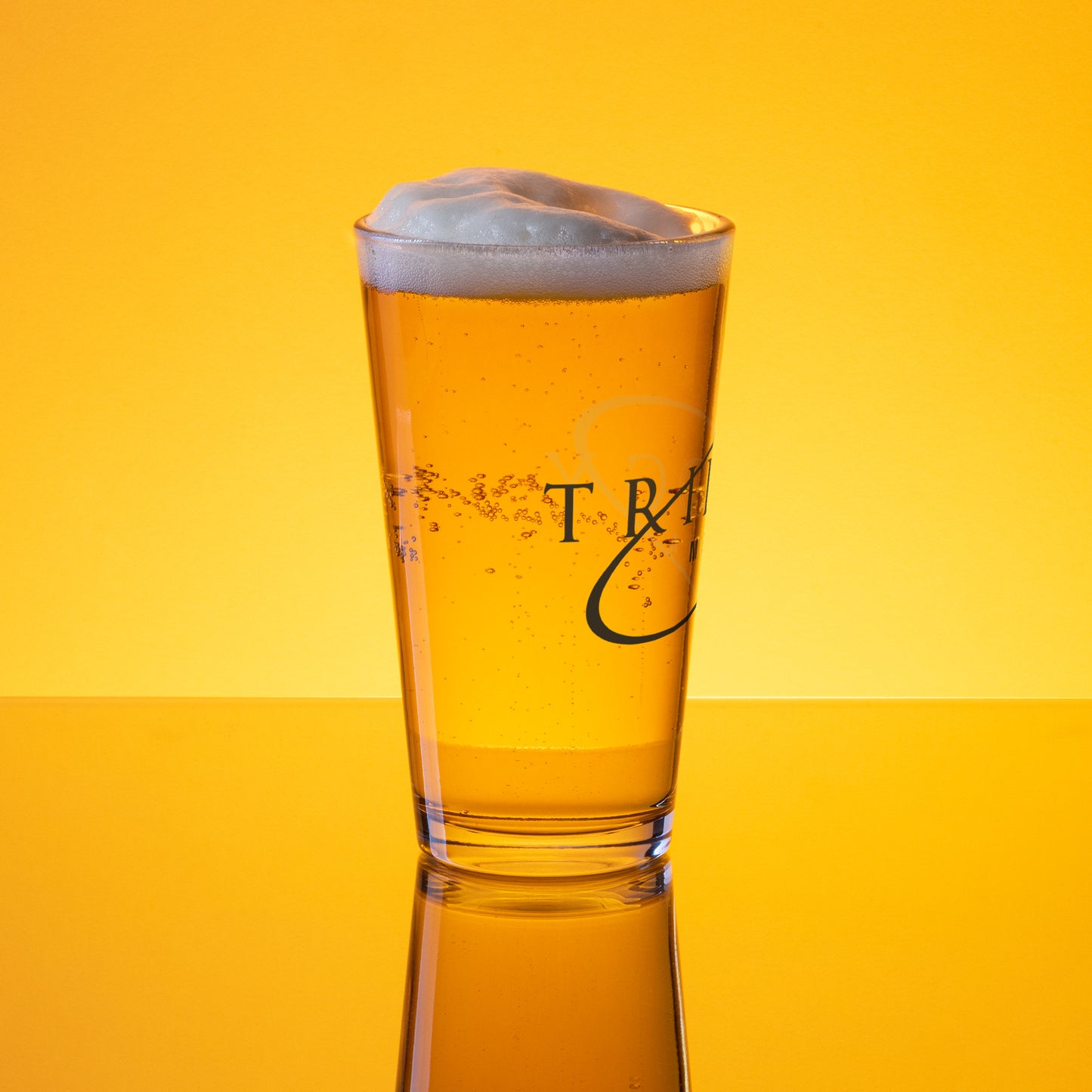 Trilogy Media Logo | Pint Glass